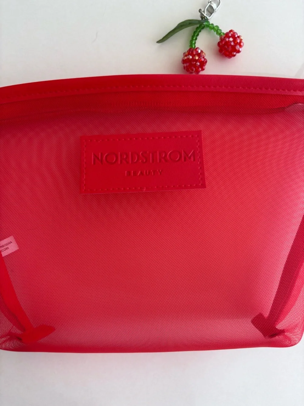 Nordstrom Beauty Bright Red Mesh Cosmetic Pouch with Wrist Strap and Cherry Char
